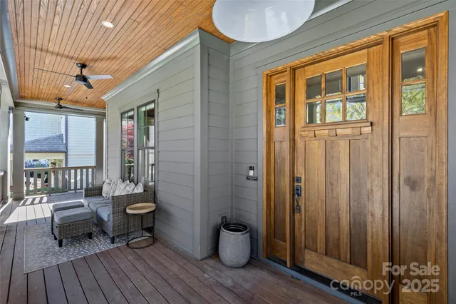 a view of a deck with chair and wooden floor