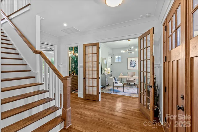a view of entryway with wooden floor and furniture