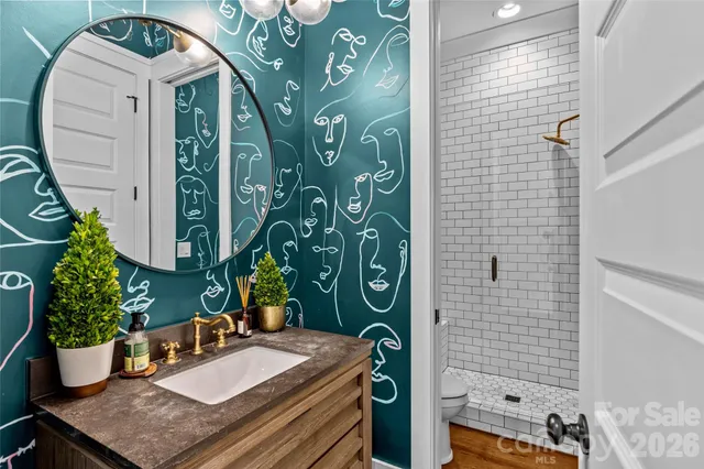 a kitchen with stainless steel appliances granite countertop a sink and a stove
