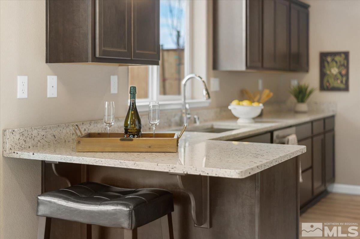 1180 Arrastra Road, Unit LOT 15 Reno, NV 89512 - Photo 11 of 34 a kitchen with a sink cabinets and a window