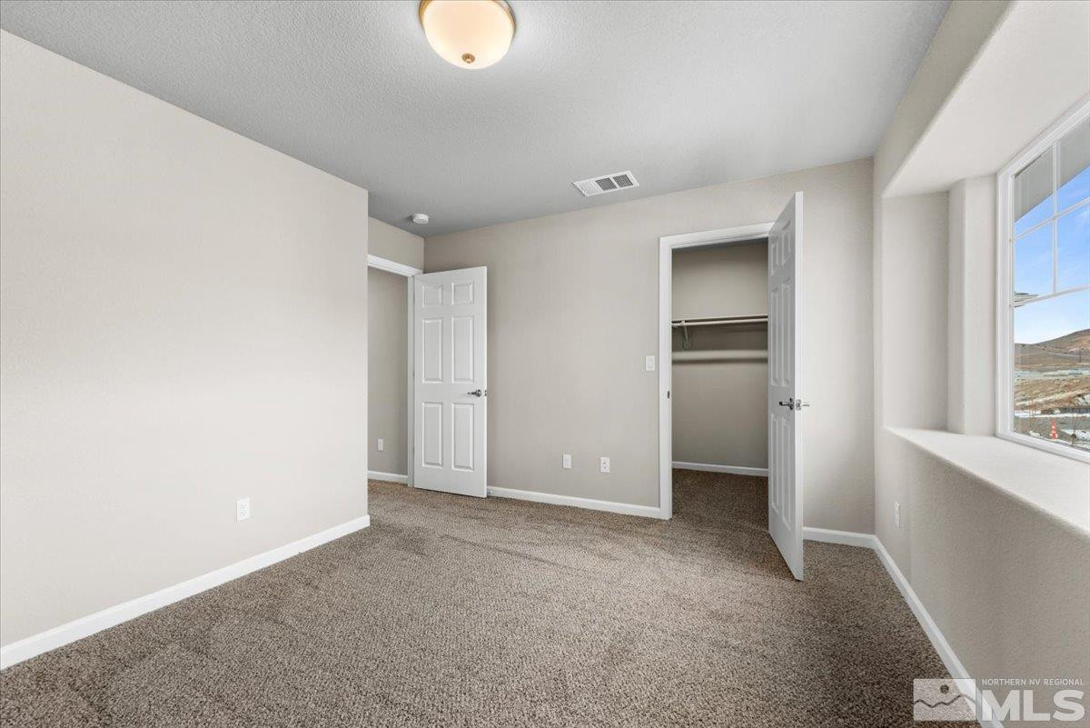 1180 Arrastra Road, Unit LOT 15 Reno, NV 89512 - Photo 29 of 34 a view of an empty room with a window