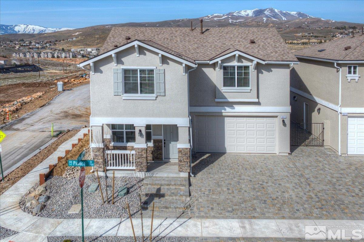 1180 Arrastra Road, Unit LOT 15 Reno, NV 89512 - Photo 4 of 34 a front view of a house with a yard