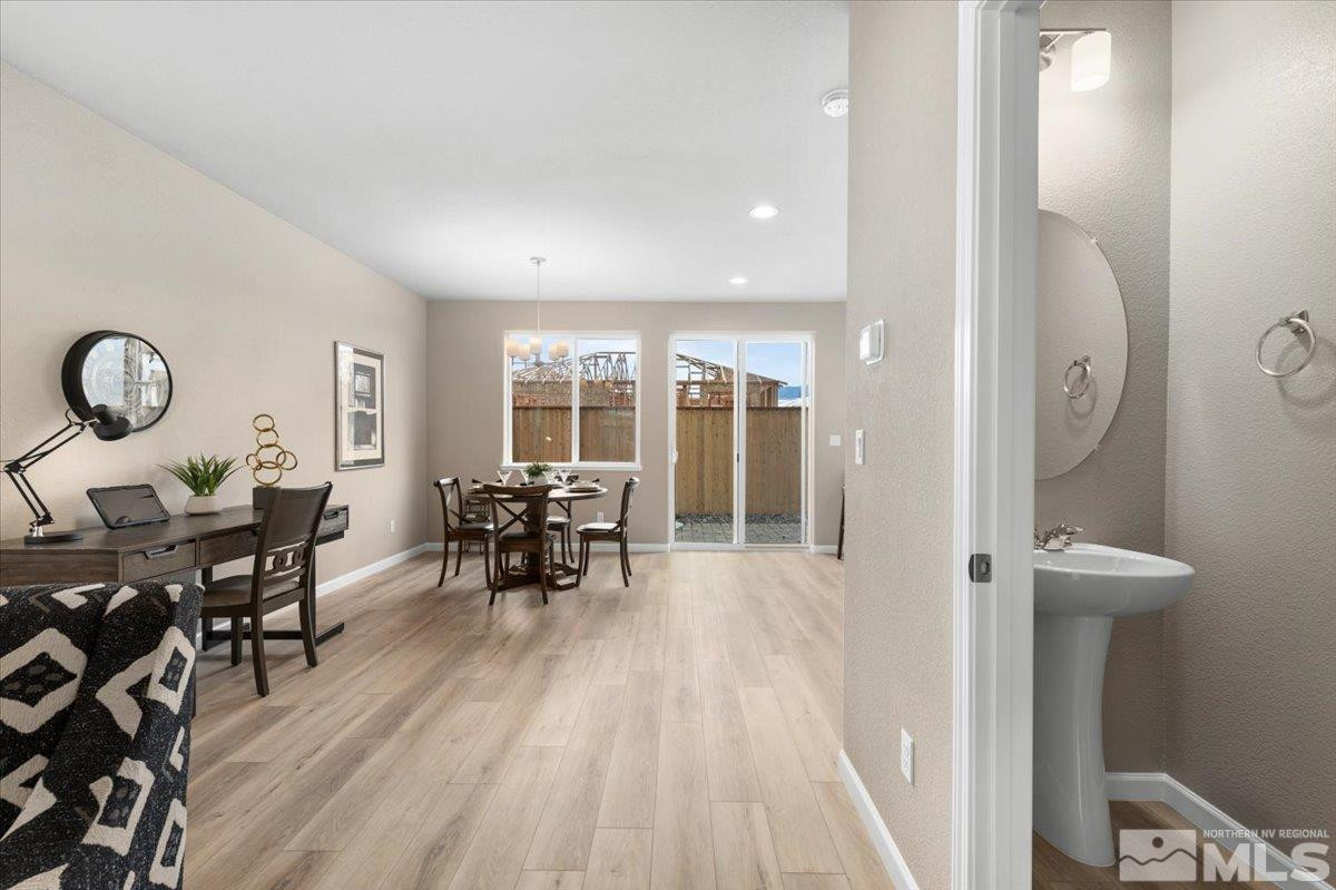 1180 Arrastra Road, Unit LOT 15 Reno, NV 89512 - Photo 7 of 34 a view of a dining room with furniture window and wooden floor