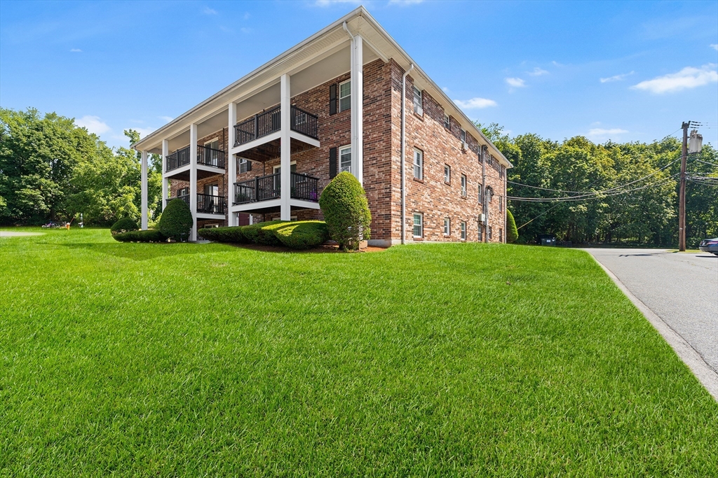 a view of a large building with a big yard