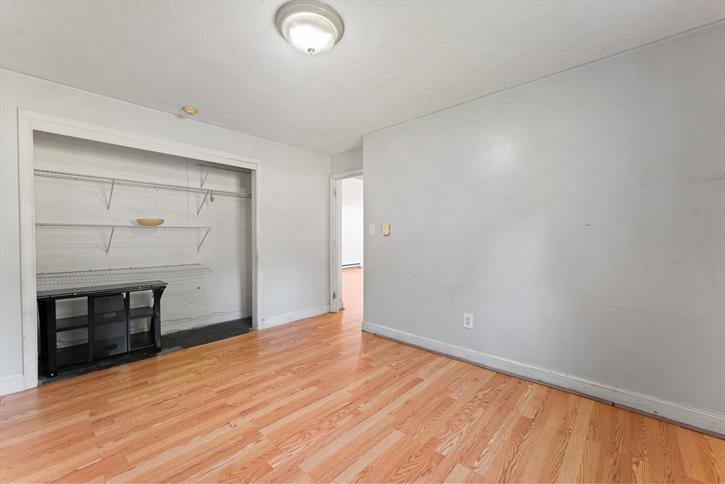 3 Walker Road, Unit 1 North Andover, MA 01845 - Photo 14 of 19 a view of an empty room with wooden floor and a window