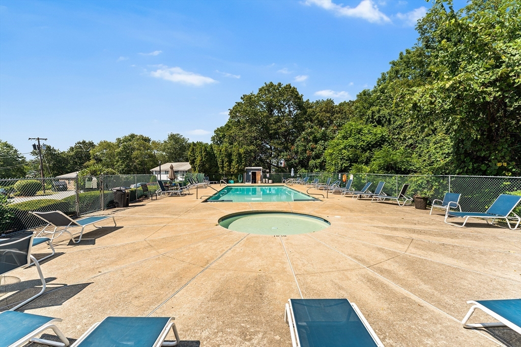 3 Walker Road, Unit 1 North Andover, MA 01845 - Photo 3 of 19 a view of swimming pool with outdoor seating and plants