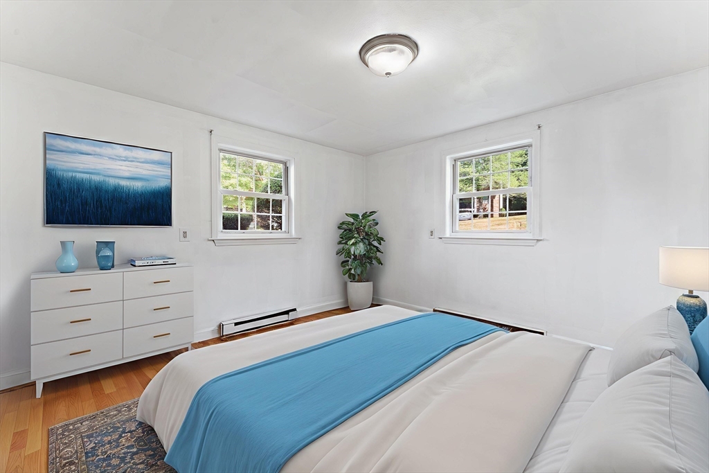 3 Walker Road, Unit 1 North Andover, MA 01845 - Photo 10 of 19 a bedroom with a bed and a flat screen tv