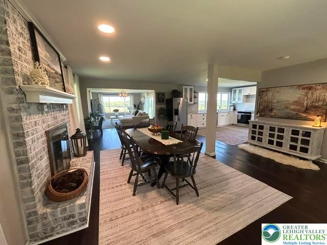 9191 Red Road Kempton, PA 19529 - Photo 11 of 25 Gleaming hardwood floors and a whitewashed brick fireplace anchor this open-concept main level.