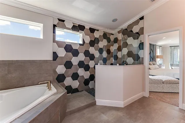 a bathroom with a bathtub and shower