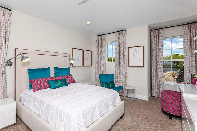 a bedroom with a bed and a couch