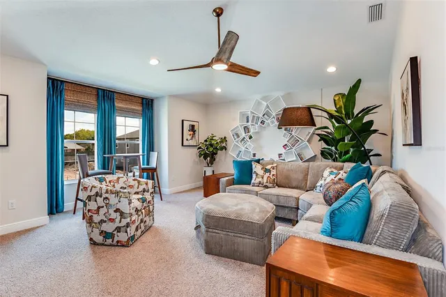 a living room with furniture and a large window