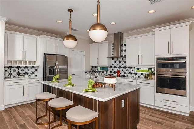 a kitchen with a sink cabinets and microwave