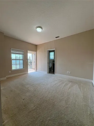 a view of balcony with wooden floor and fence