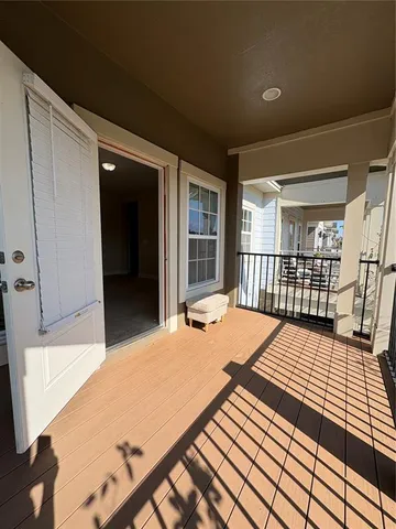 a bathroom with a sink toilet vanity and window
