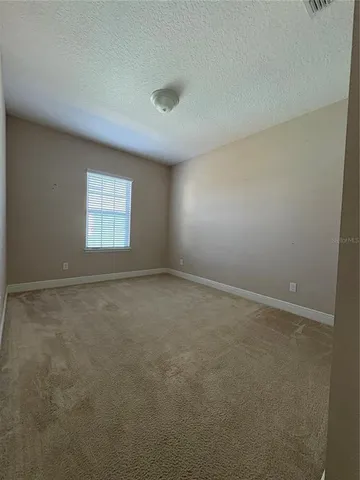 a bathroom with a double vanity sink a toilet and a bathtub