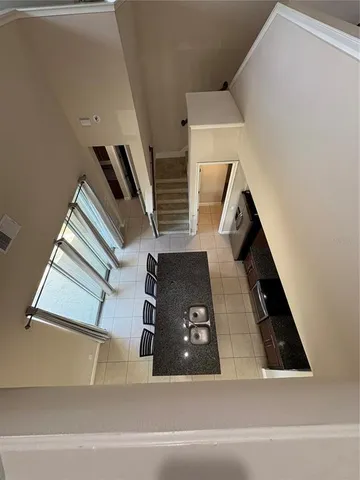 a view of a hallway with stairs