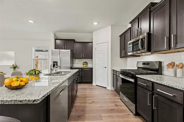 a close view of a utility room with dryer and washer