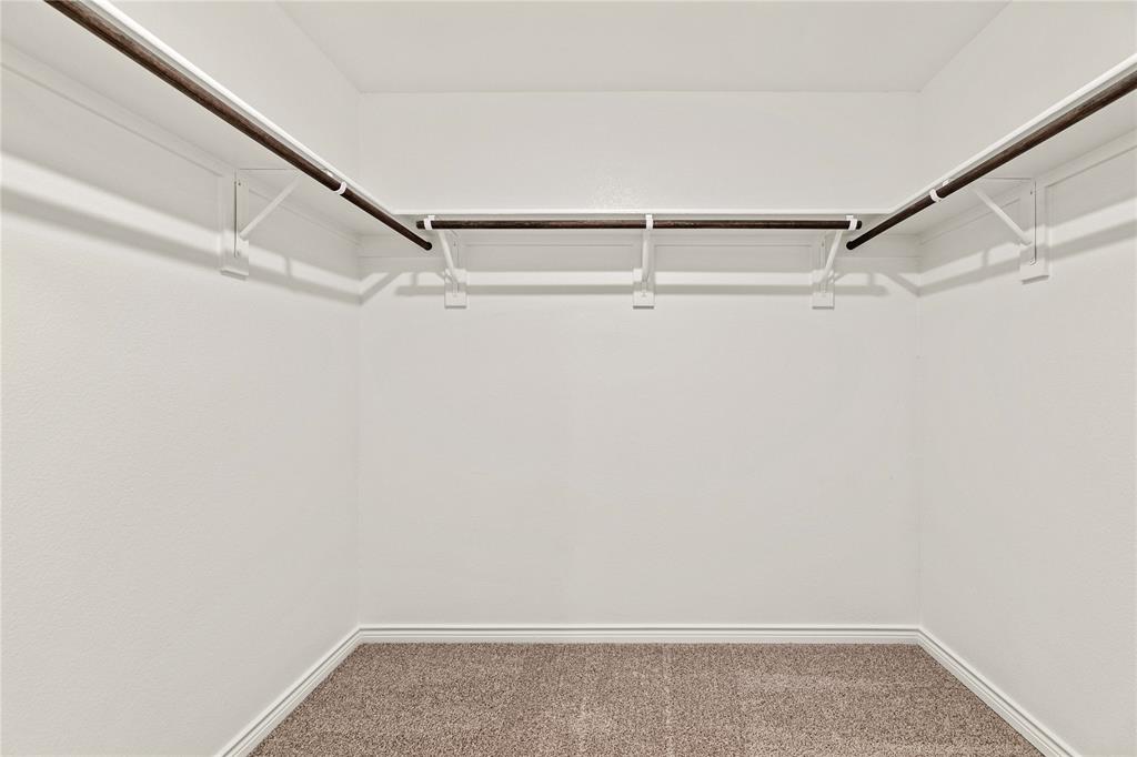 411 Revolution Road Fate, TX 75087 - Photo 13 of 34 a view of an empty walk in closet