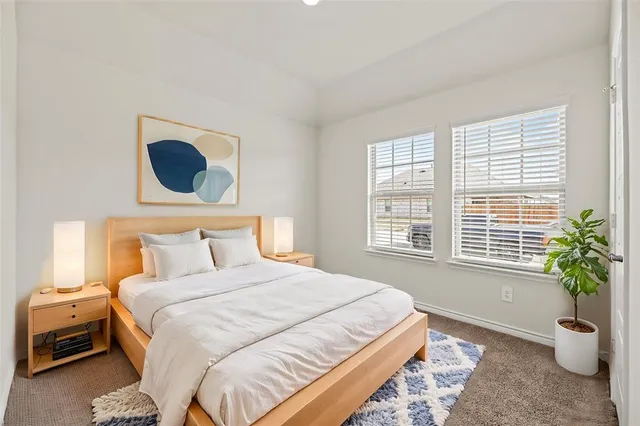 a view of a kitchen with a sink a refrigerator and a stove top oven