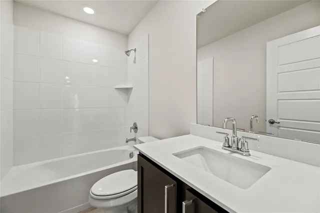 a view of a kitchen with refrigerator stove and wooden floor