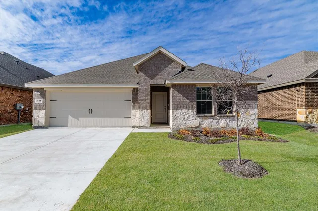 a view of a workspace with furniture and wooden floor