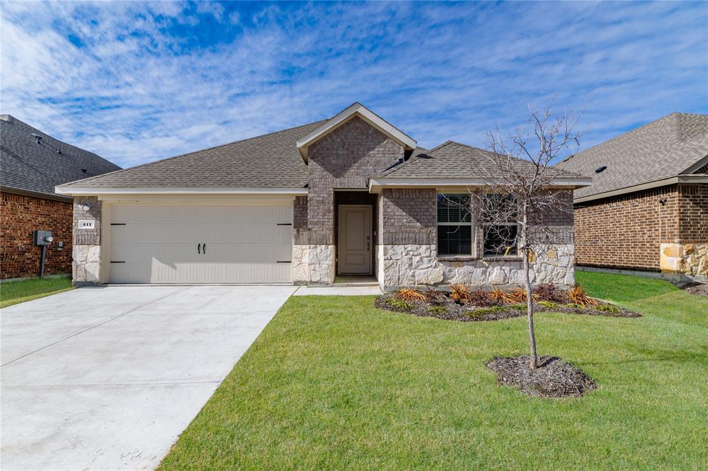 411 Revolution Road Fate, TX 75087 - Photo 4 of 34 a front view of a house with a yard