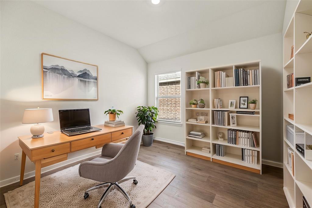 411 Revolution Road Fate, TX 75087 - Photo 6 of 34 a view of a workspace with furniture and wooden floor