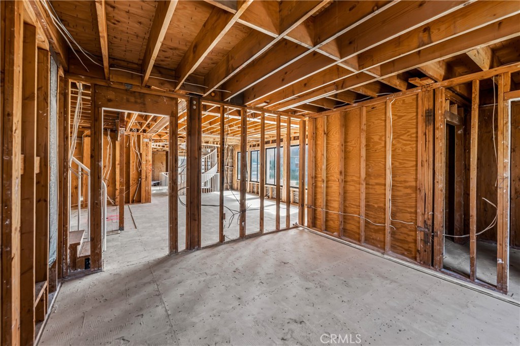 16995 8th Street Sunset Beach, CA 90742 - Photo 12 of 51 a view of an empty room with wooden walls