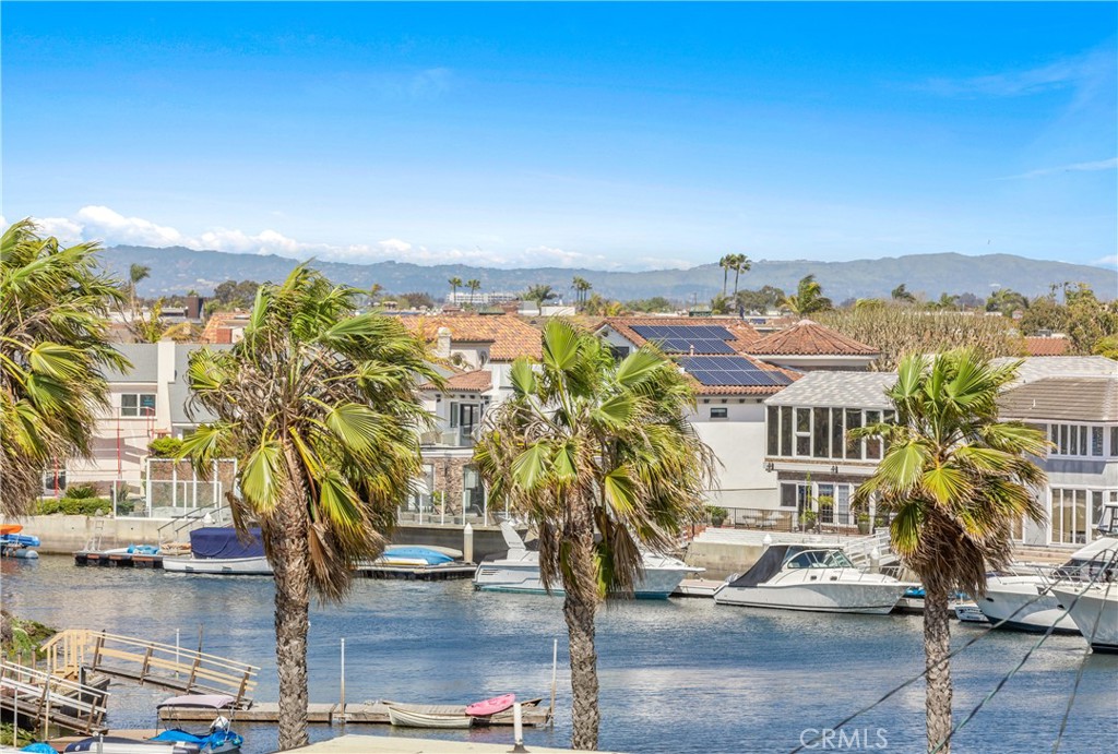 16995 8th Street Sunset Beach, CA 90742 - Photo 30 of 51 a view of building with yard and ocean view