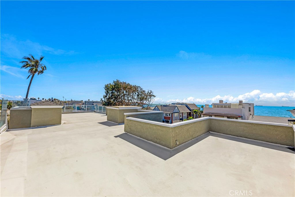 16995 8th Street Sunset Beach, CA 90742 - Photo 34 of 51 a view of a terrace with a bench