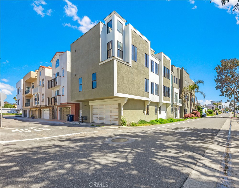 16995 8th Street Sunset Beach, CA 90742 - Photo 39 of 51 a front view of a building with a street