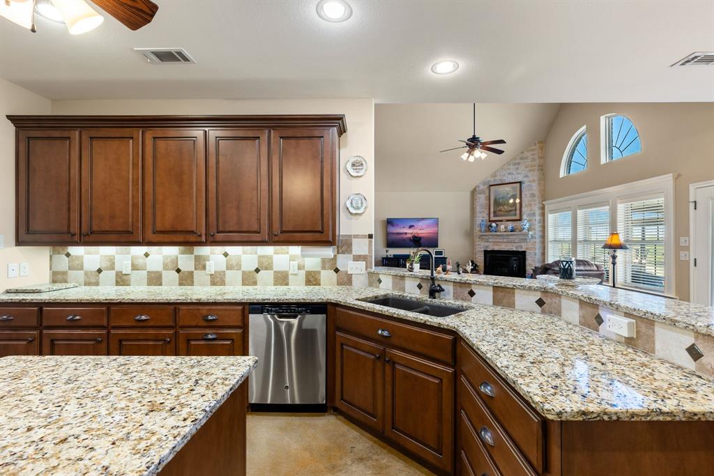 3794 County Road 1089 Celeste, TX 75423 - Photo 11 of 40 a kitchen with a sink stove and cabinets