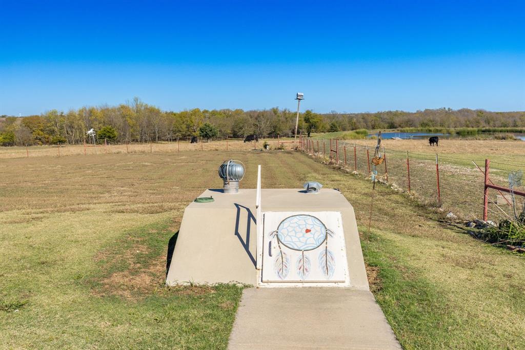 3794 County Road 1089 Celeste, TX 75423 - Photo 28 of 40 a view of a lake with houses in the background