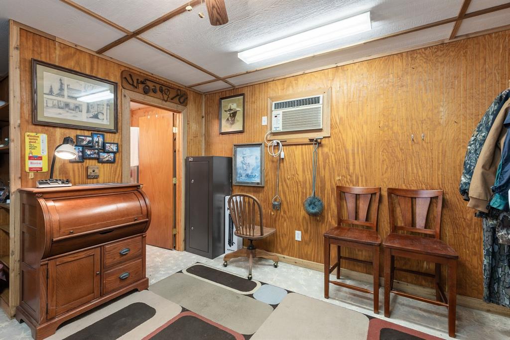 3794 County Road 1089 Celeste, TX 75423 - Photo 32 of 40 Misc room featuring wooden walls and ceiling fan