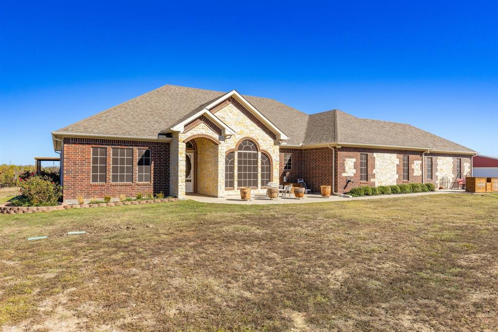 3794 County Road 1089 Celeste, TX 75423 - Photo 35 of 40 a front view of a house with a garden