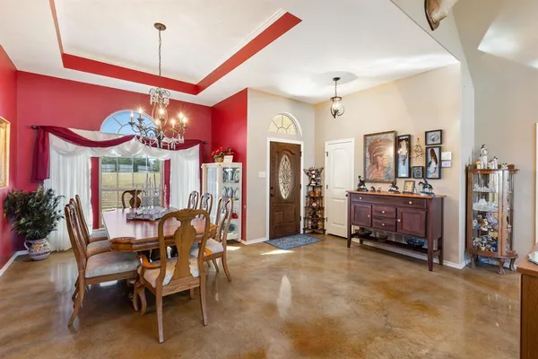 a kitchen with granite countertop a sink stove and refrigerator