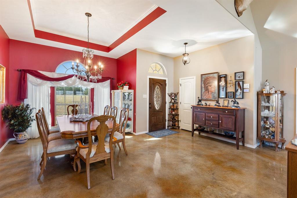 3794 County Road 1089 Celeste, TX 75423 - Photo 6 of 40 a view of a dining room with furniture and chandelier
