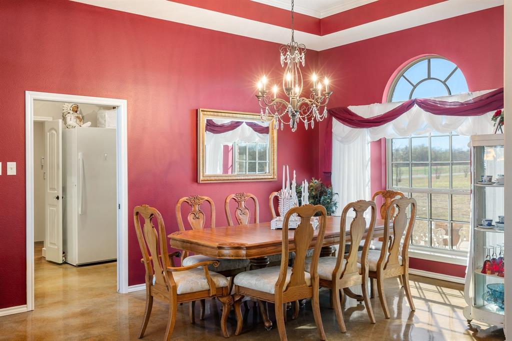 3794 County Road 1089 Celeste, TX 75423 - Photo 8 of 40 a view of a dining room with furniture and chandelier