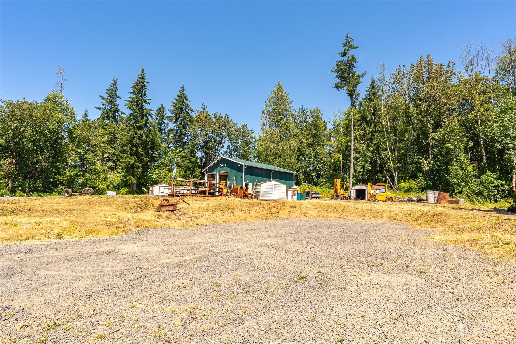 149 Knowles Road Winlock, WA 98596 - Photo 5 of 38 a view of a swimming pool with an outdoor space and seating area