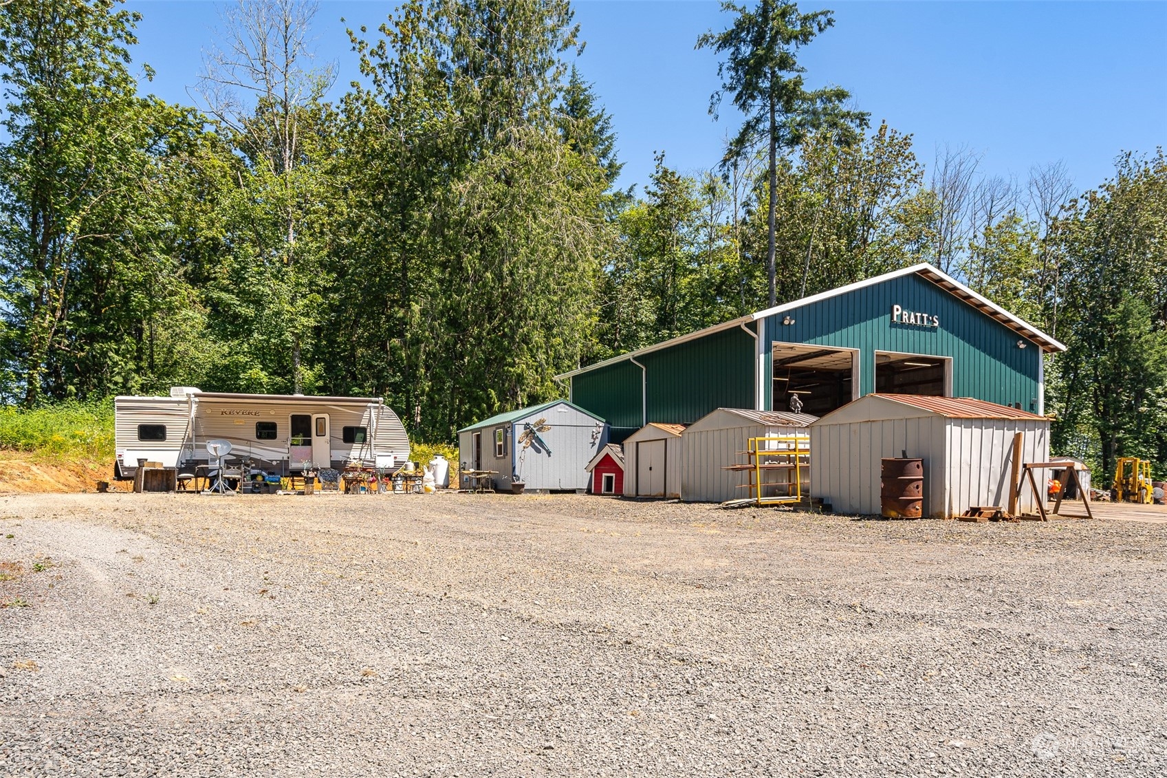 149 Knowles Road Winlock, WA 98596 - Photo 9 of 38 a view of a house with large space and a car parked