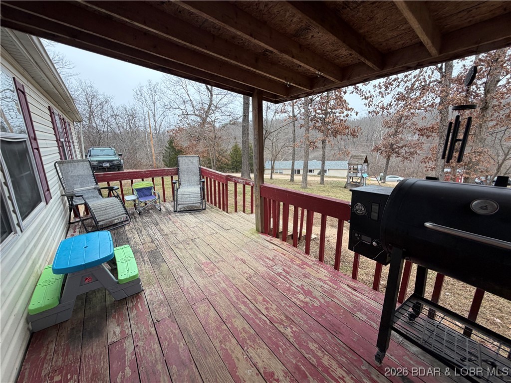 7 Arapaho Road Eldon, MO 65026 - Photo 4 of 26 front porch with open deck area