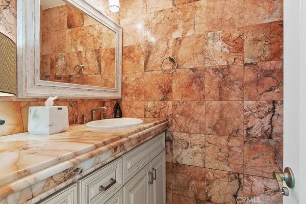 a bedroom with a bed and glass window