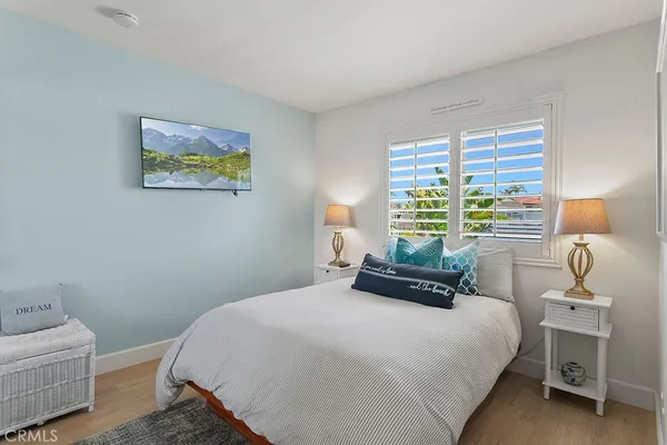 an outdoor sitting area with furniture and city view