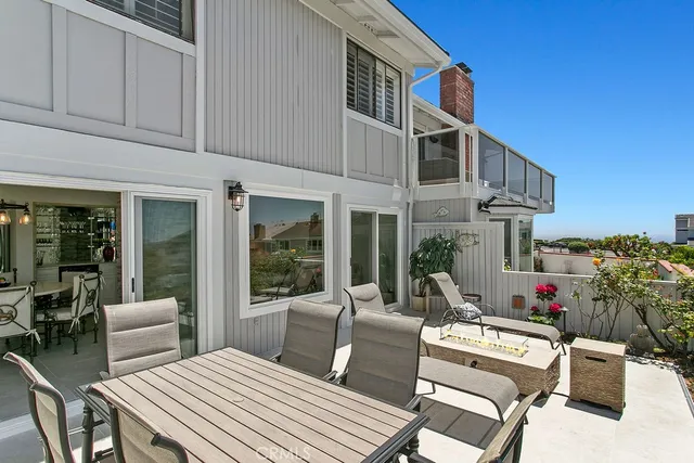 an aerial view of a house with a yard and lake view