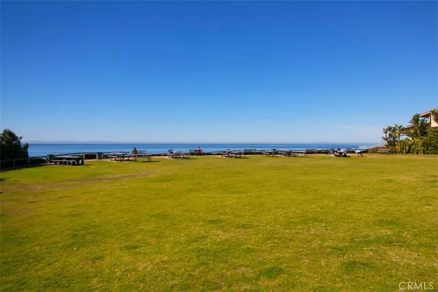 a sign that is sitting in front of flowers
