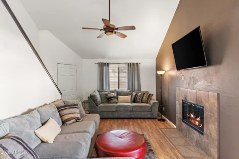 a living room with furniture and a fireplace
