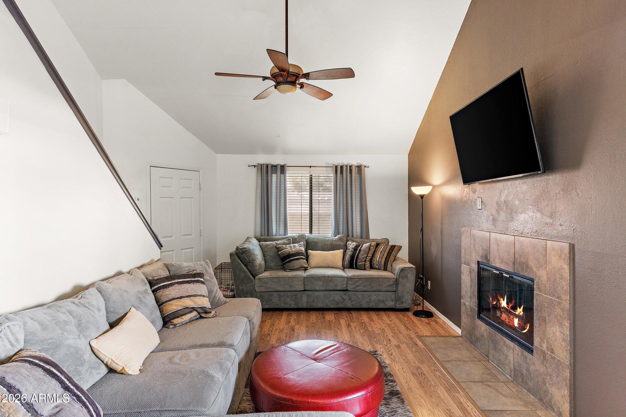 222 West Brown Road, Unit 57 Mesa, AZ 85201 - Photo 11 of 21 a living room with furniture and a fireplace