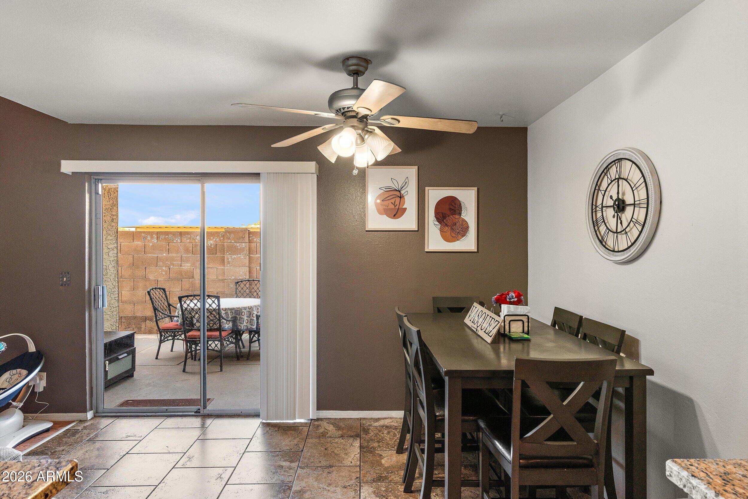 222 West Brown Road, Unit 57 Mesa, AZ 85201 - Photo 14 of 21 a view of a dining room with furniture and a large window