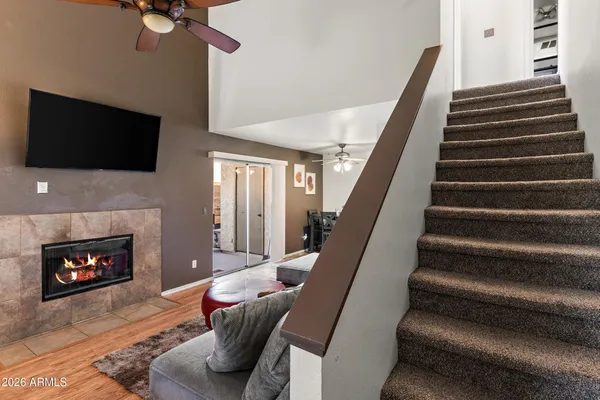 a living room with furniture and a fireplace