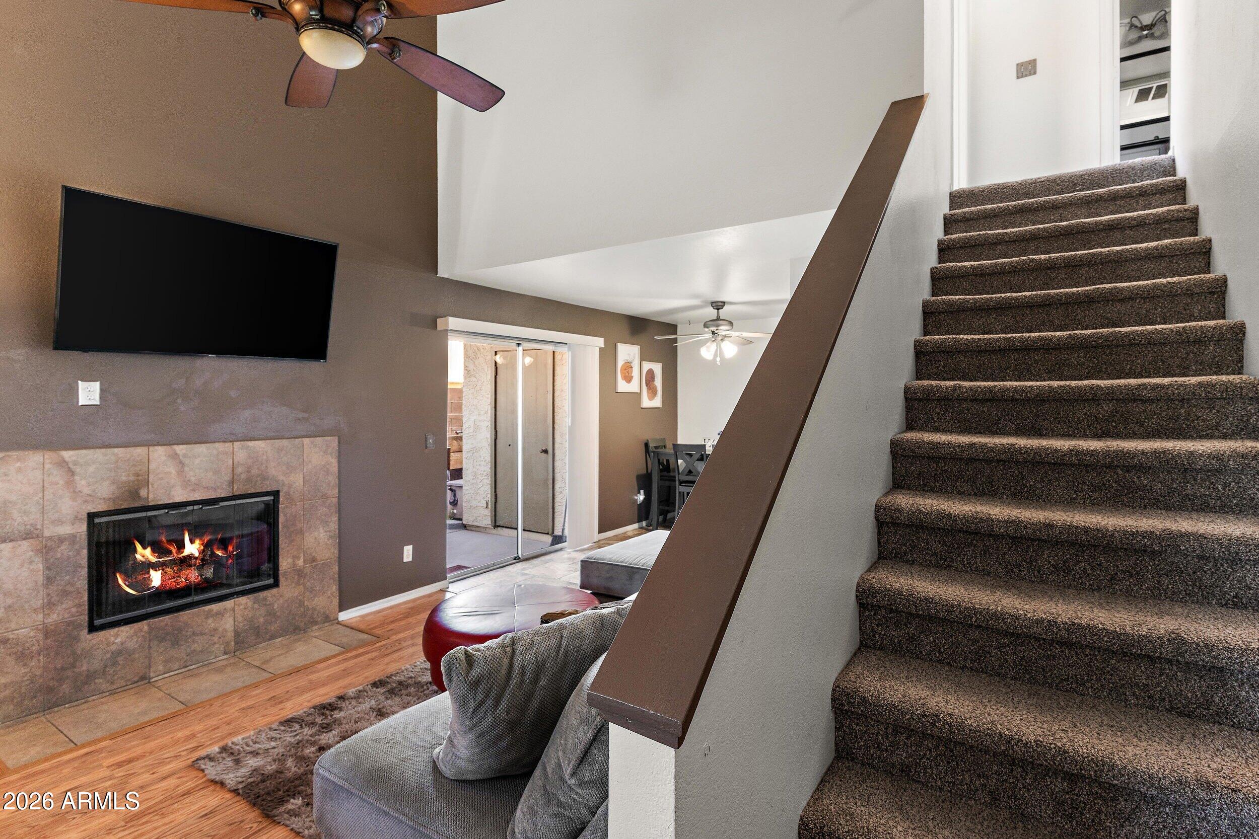 222 West Brown Road, Unit 57 Mesa, AZ 85201 - Photo 7 of 21 a living room with furniture and a fireplace